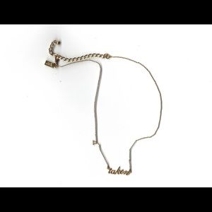 Gold Kate spade “taken” necklace